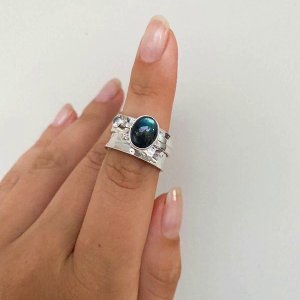 Mechanical ring with labradorite and zircon