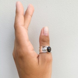 Mechanical ring with black onyx and zircon