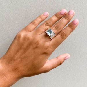 Blue and white topaz mechanical ring